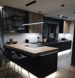 Kitchen with black metal-framed kitchen cabinets and a wood countertop.