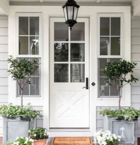 Charming cottage white X-panel opening door with grid glass panels