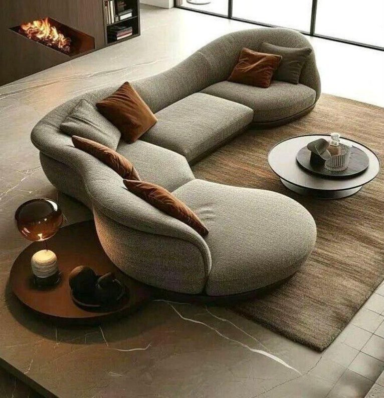 Grey Fabric Curved Sofa displays plush texture, luxe elegant, engineered for comfort, create inviting ambiance in luxury living rooms.