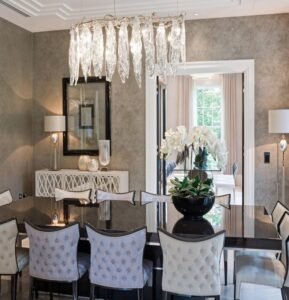 Grey Tufted Luxe Dining Chairs display tufted design, plush texture, create lavish ambiance in opulent dining spaces with their elegant details.
