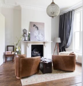 Brown Vintage Leather Armchairs feature aged leather, vintage style, create cozy ambiance in eclectic living spaces with their retro design.