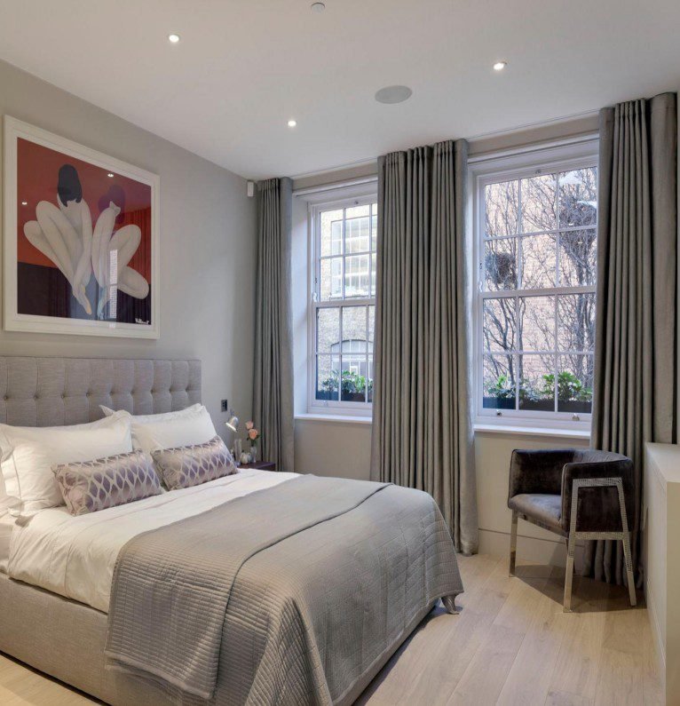 Grey Pleated Curtains showcase sleek texture, modern minimalist, crafted for privacy, add refined charm to contemporary bedrooms.