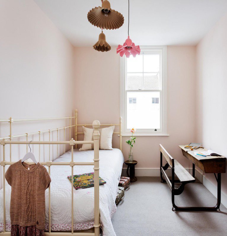 Vintage Iron Single Bed boasts retro texture, minimalist style, create warm ambiance in compact small bedroom spaces.