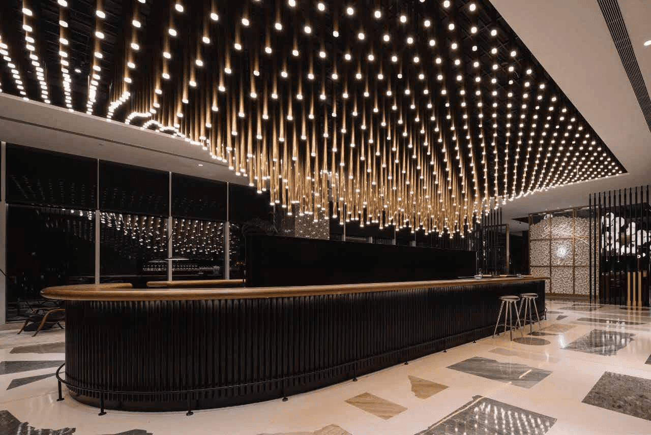 Classic crystal chandelier hanging in a grand dining room, showing how chandeliers add elegance and ambient lighting.
