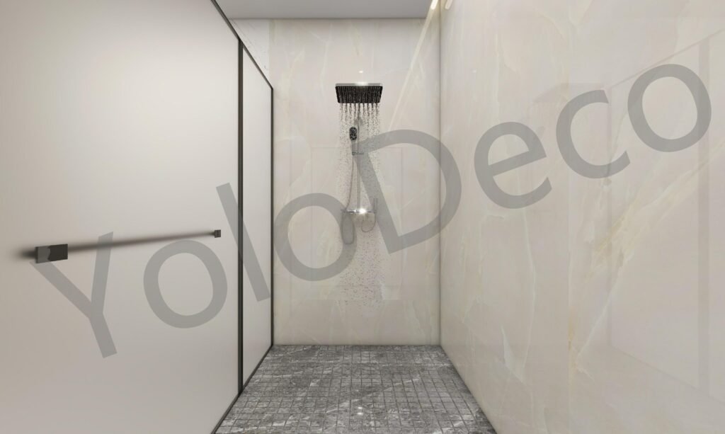 Master bathroom vanity with backlit mirror and blue scalloped feature tiles against white marble walls.