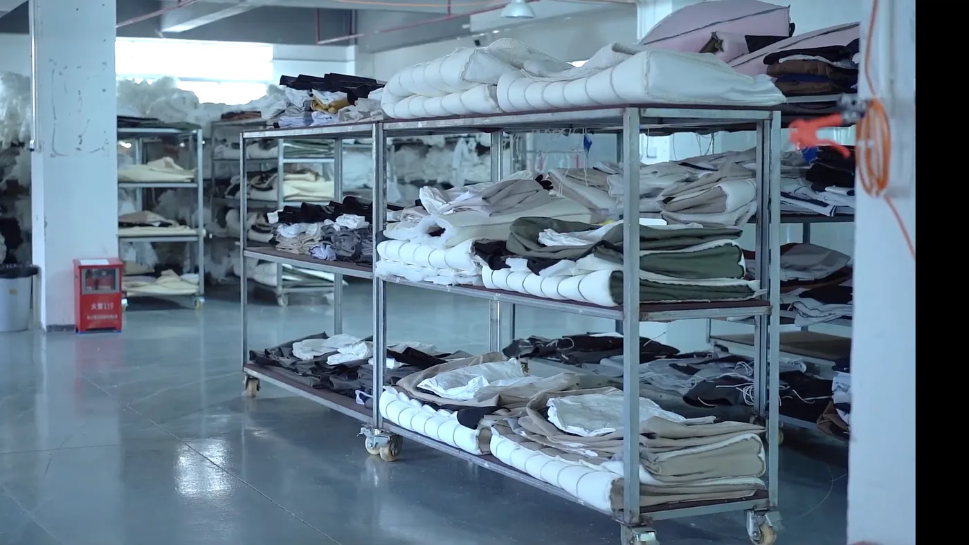 Rolls of carpet and fabric stored in the workshop