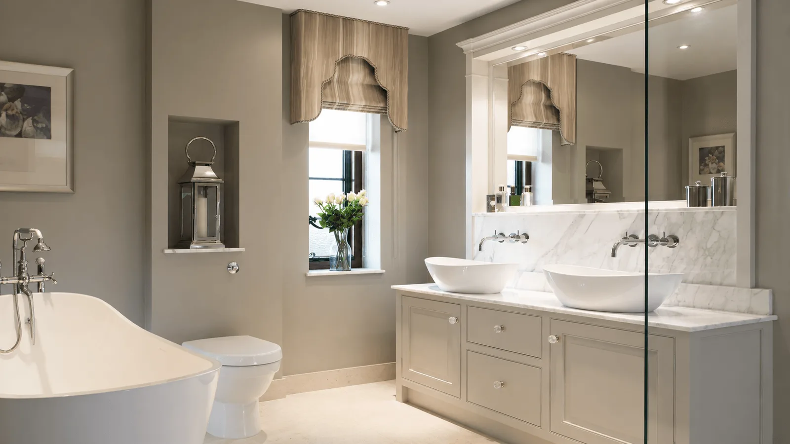Bathroom with a freestanding tub, vanity and mirror cabinet