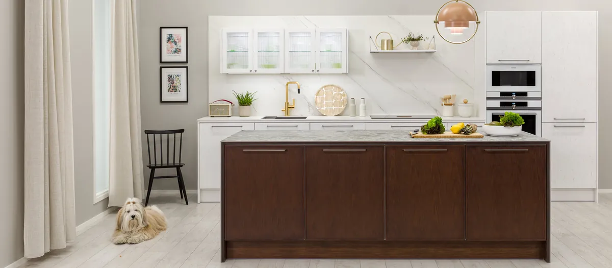 Puustelli Miinus kitchen with biocomposite-frame cabinetry, dark wood island and white wall cabinets