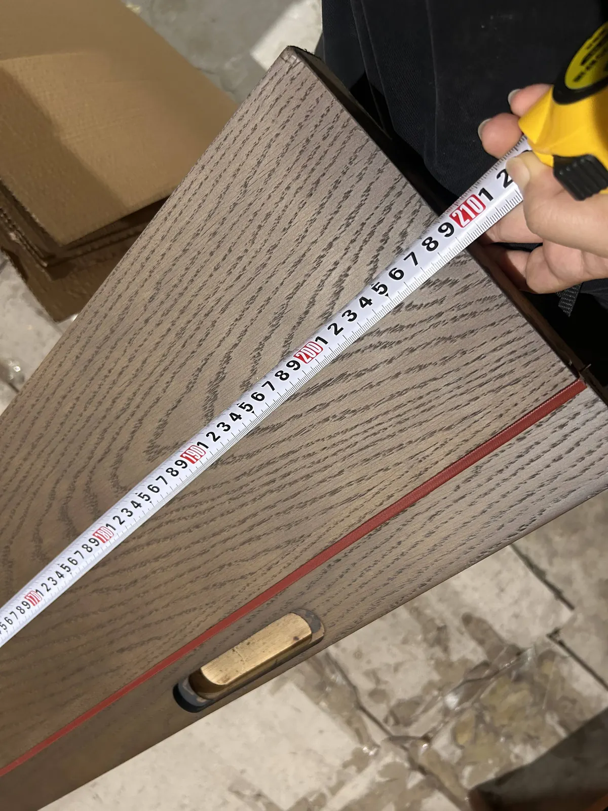 Dimensional check of a wood-finish furniture panel